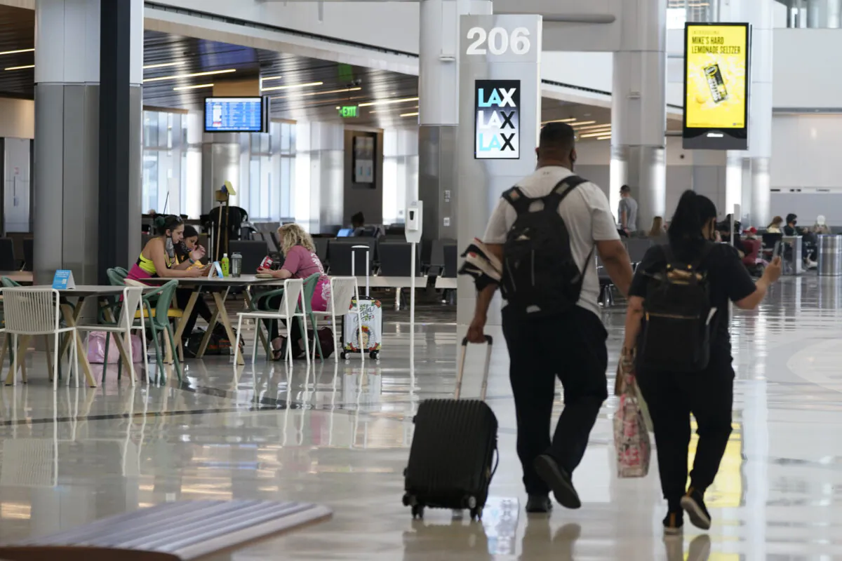 Passengers wait for their flights inside the new West Gates at Tom Bradley International Terminal at Los Angeles International Airport on May 24, 2021. (Ashley Landis/AP Photo)