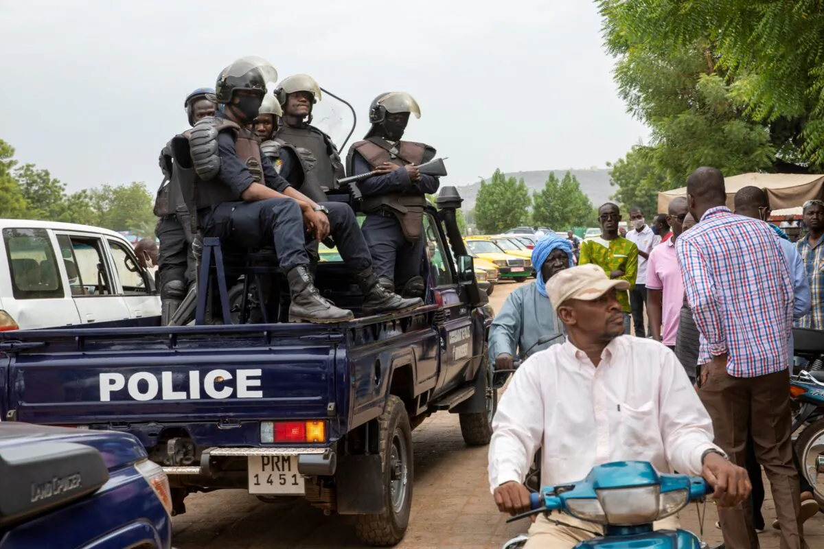 Malian police gather outside the Bourse du Travail where striking workers gathered to protest the arrest of President Bah N'Daw and Prime Minister Moctar Ouane by military personnel in Bamako, Mali, on May 25, 2021. (AP Photo)