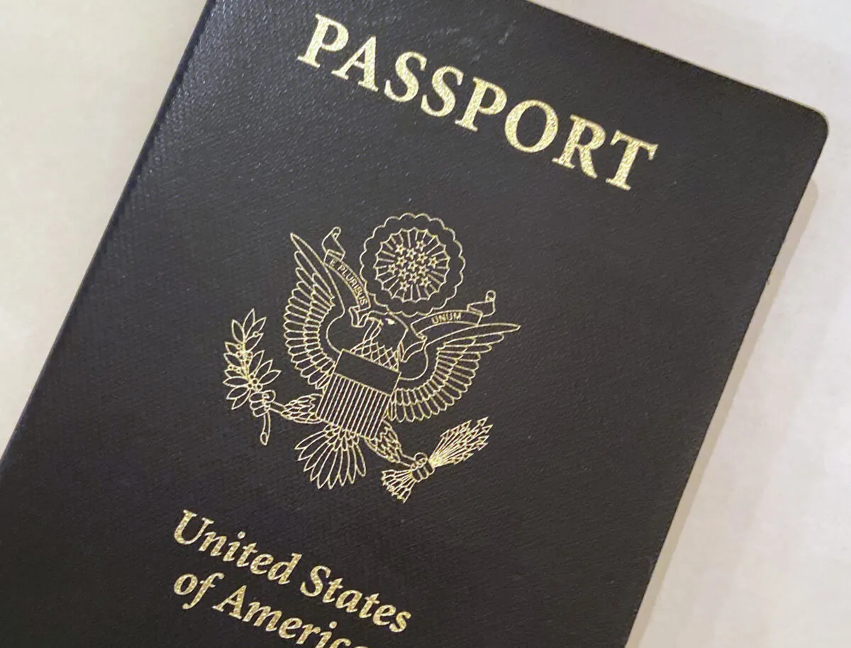 A U.S. Passport cover in Washington. The Biden administration says American citizens holding recently expired U.S. passports will be allowed to return home from abroad on that document until the end of year. (AP Photo/Eileen Putman)