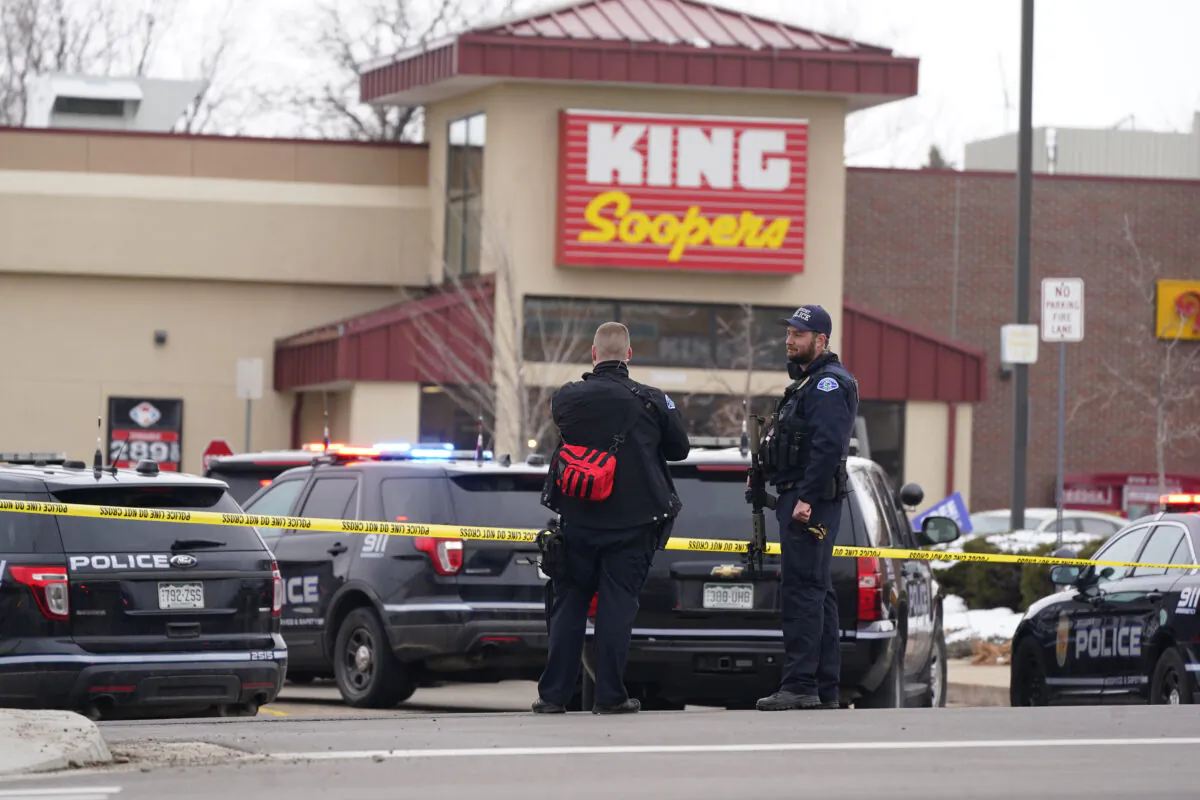 Police work on the scene outside of a King Soopers grocery store where a shooting took place in Boulder, Colo., on March 22, 2021. (David Zalubowski/AP Photo)