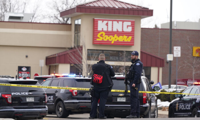 Police work on the scene outside of a King Soopers grocery store where a shooting took place in Boulder, Colo., on March 22, 2021. (David Zalubowski/AP Photo)