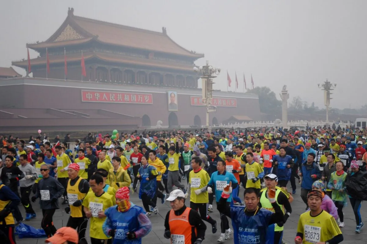 Runners take part in the 34th Beijing International Marathon, which began at Tiananmen Square in Beijing, China, on Oct. 19, 2014. (AFP/Getty Images)