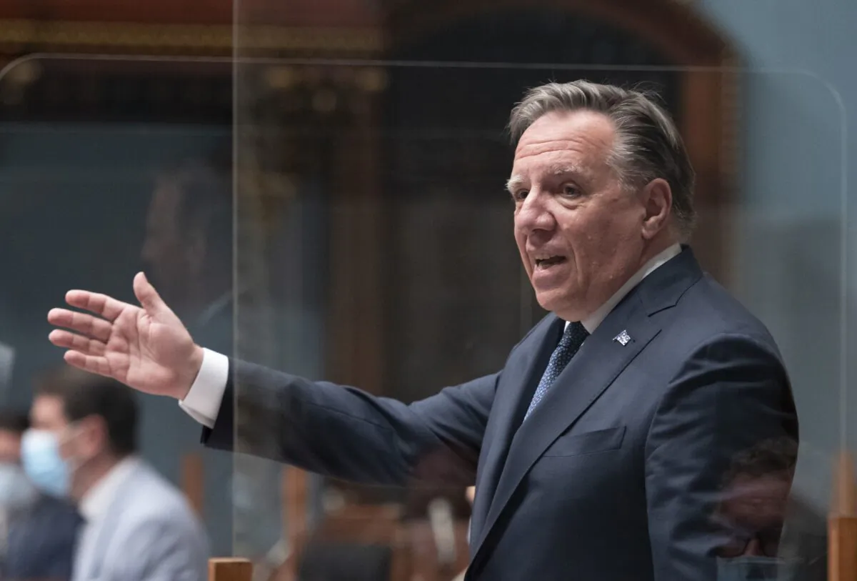 Quebec Premier François Legault rises during question period at the legislature in Quebec City on May 25, 2021. Quebec will not pursue the development of the fossil fuel industry, Legault announced on Oct. 19, 2021. (THE CANADIAN PRESS/Jacques Boissinot)