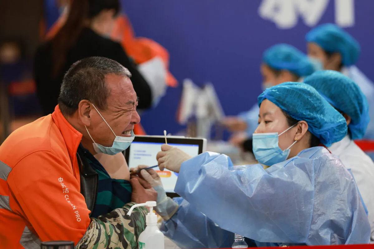 A Chinese worker receiving the China National Biotec Group (CNBG) COVID-19 coronavirus vaccine in Shenyang of China's northeastern Liaoning Province on May 23, 2021. (STR/AFP via Getty Images)