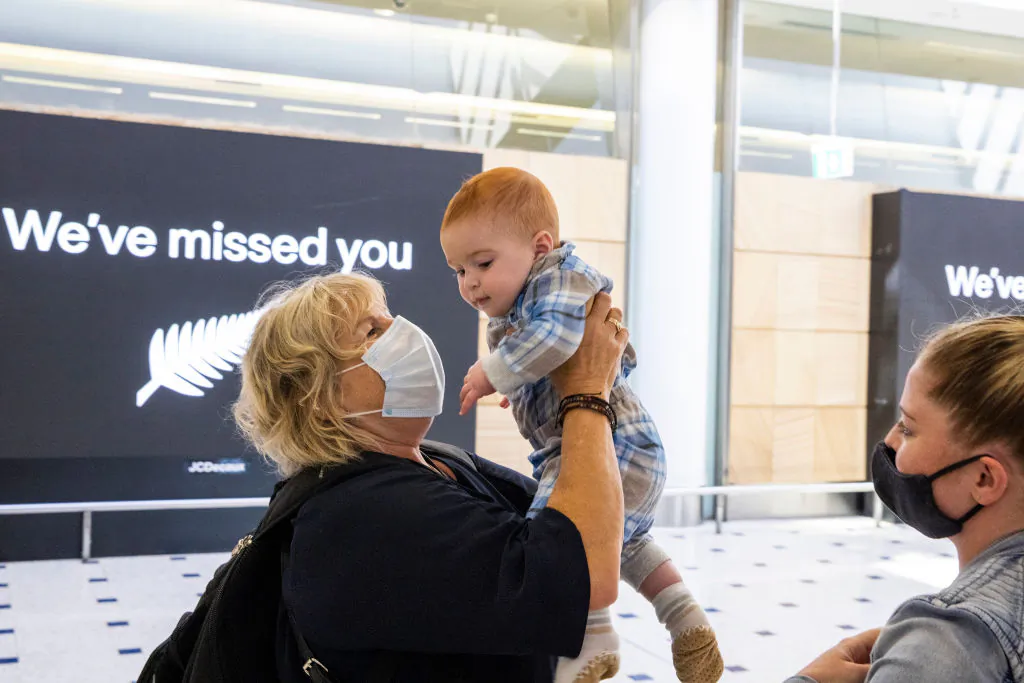 Woman hugs her grandson who she meets for the first time  at Sydney International Airport as NZ-Australia travel bubble opens on April 19, 2021 in Sydney, Australia. (Jenny Evans/Getty Images)