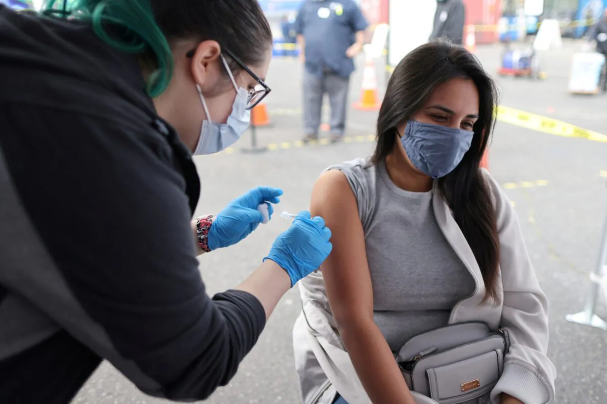Esperanza Guevara, 31, receives a Johnson & Johnson COVID-19 vaccine in Los Angeles on March 25, 2021. (Lucy Nicholson/Reuters)