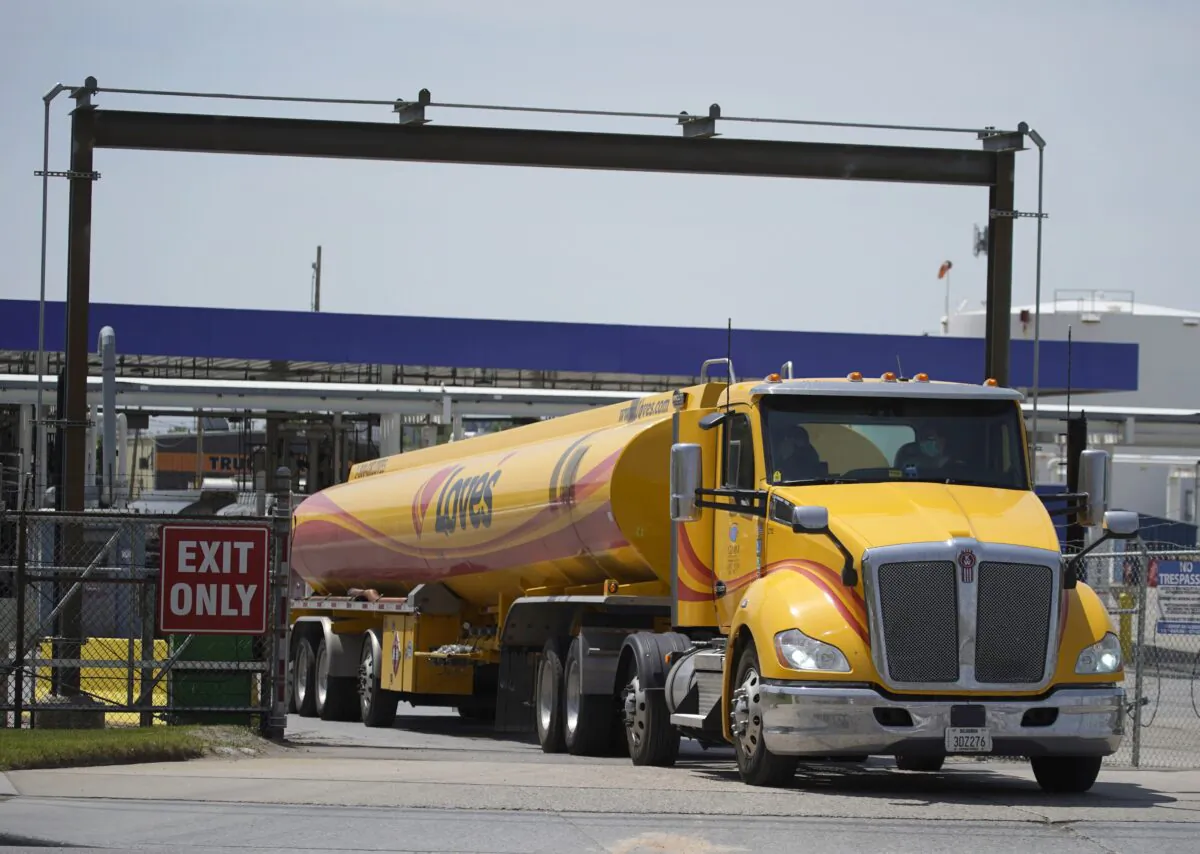 A driver leaves the yard after filling up his gas tanker truck at Marathon Oil in Salt Lake City, Utah, on May 20, 2021. (George Frey/Getty Images)