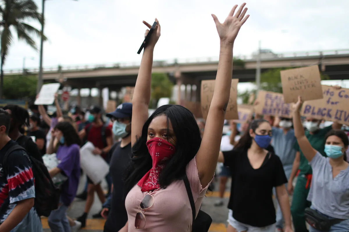 People participate in a protest in Miami, Fla., on June 2, 2020. (Joe Raedle/Getty Images)