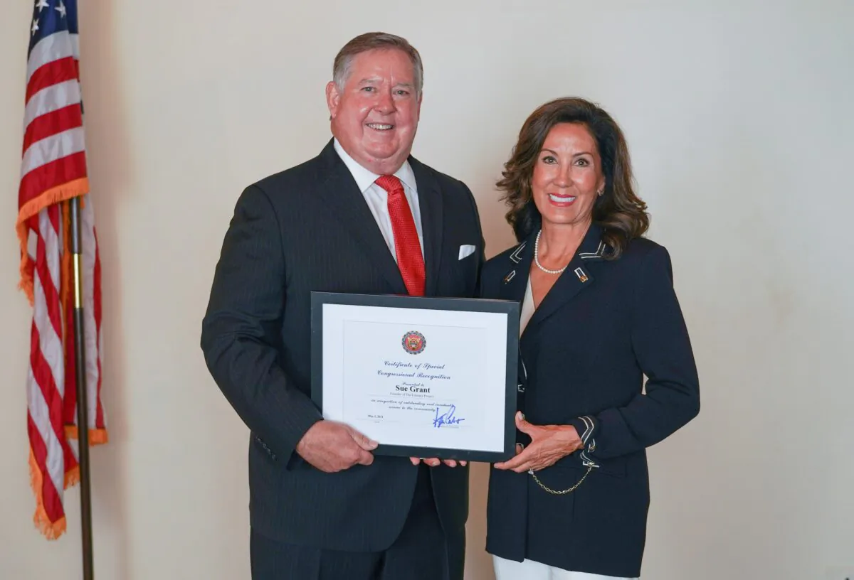 Rep. Ken Calvert presents a congressional award to  Literacy Project Foundation founder and volunteer CEO Sue Grant. (Courtesy of Nepal Arslan)