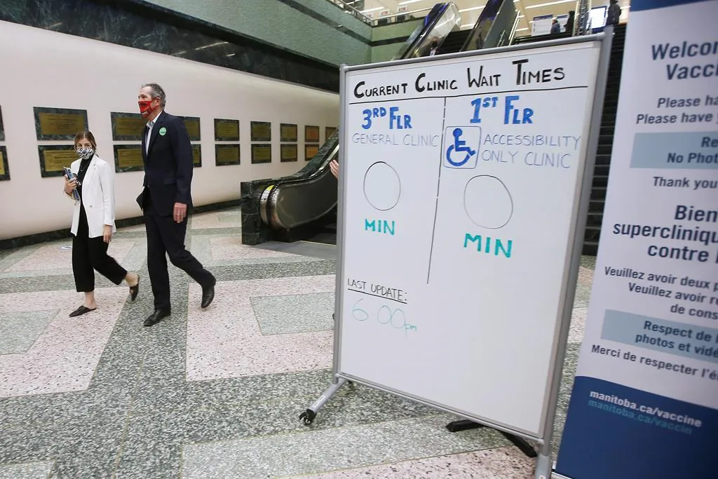 Manitoba Premier Brian Pallister leaves the convention centre after getting a COVID-19 vaccination from Dr. Brent Roussin, chief provincial public health officer, in Winnipeg, on April 8, 2021. (John Woods/The Canadian Press)