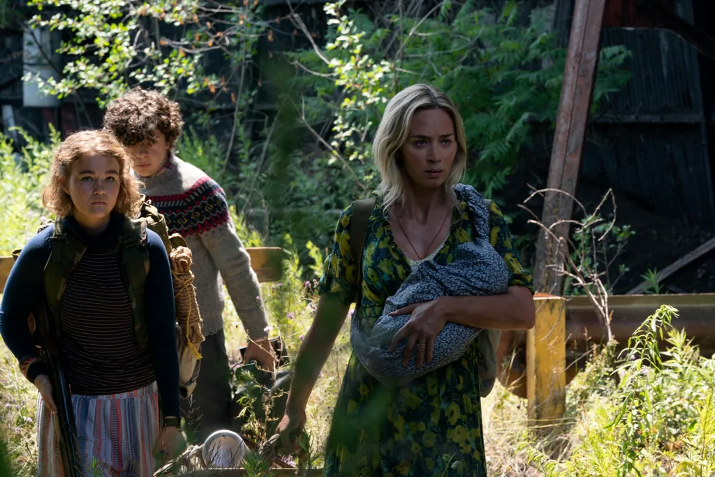 (L–R) Regan Abbott (Millicent Simmons), her younger brother Marcus (Noah Jupe), and their  mother, Evelyn, (Emily Blunt) must stay quiet to survive hostile aliens, in “‘A Quiet Place Part II.” (Paramount Pictures)