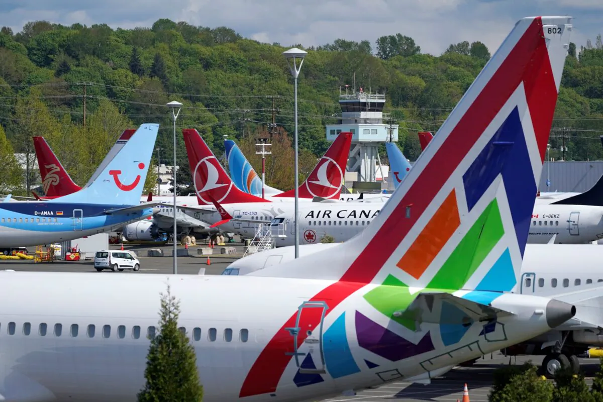 Boeing 737 Max airplanes sit parked in a storage lot near Boeing Field in Seattle on April 26, 2021. (Ted S. Warren/AP Photo)