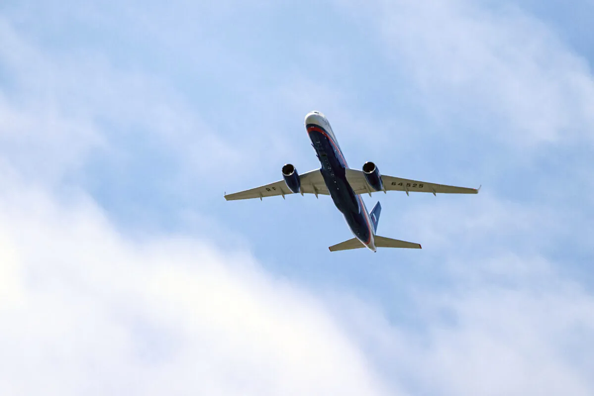 A Russian Air Force Tu-214 flies over Offutt Air Force Base on Friday, April 26, 2019, in Omaha, Neb. (Chris Machian/Omaha World-Herald via AP File)