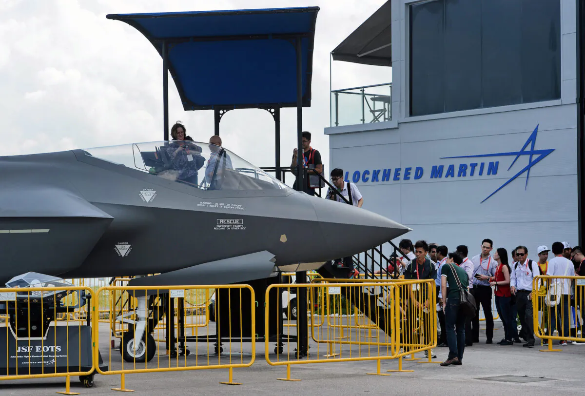 Visitors queue to have closer look at a static display of a Lockheed Martin F-35 at the Singapore Airshow in Singapore on Feb. 18, 2016.  (Roslan Rahman/AFP via Getty Images)