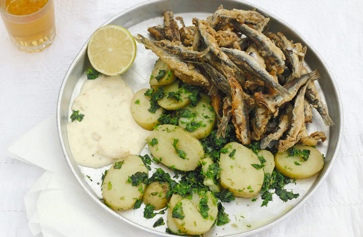 Fried anchovies with potatoes, chopped herbs, and lemon mayonnaise. (Elena Heatherwick)