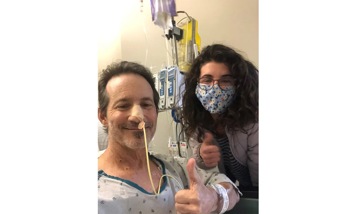 Frank Coburn poses with his daughter while recovering from a double lung transplant at Cedars-Sinai Medical Center in Los Angeles. (Courtesy of Frank Coburn)