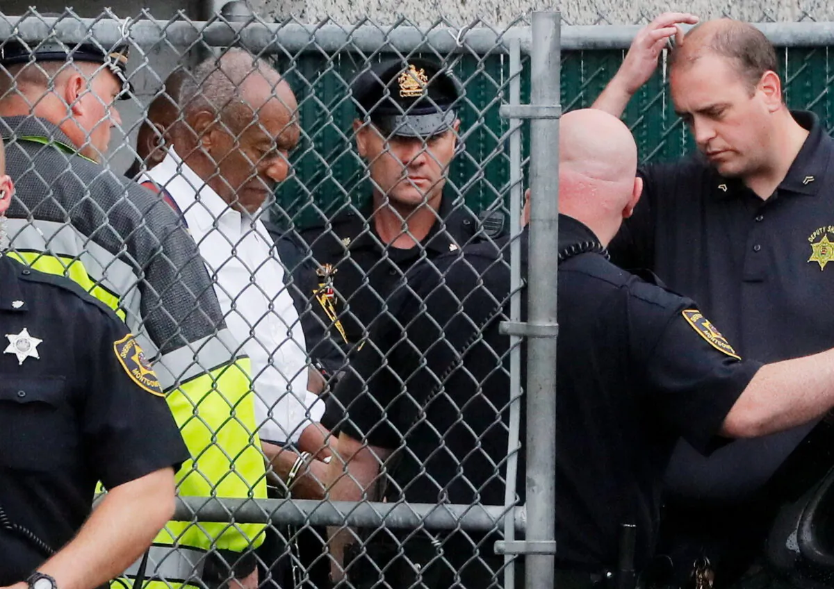 Actor and comedian Bill Cosby leaves the Montgomery County Courthouse in handcuffs after sentencing in his sexual assault trial in Norristown, Pennsylvania, on Sept. 25, 2018. (Brendan McDermid/Reuters)