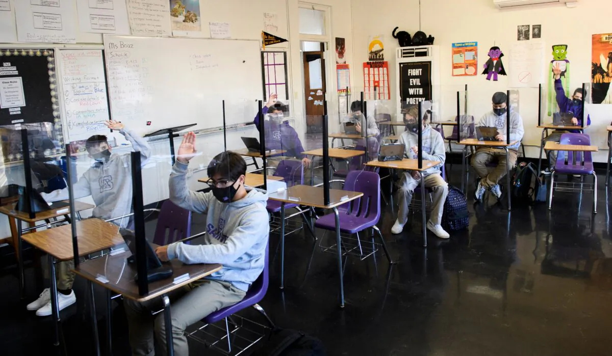 Students attend an in-person English class at St. Anthony Catholic High School in Long Beach, Calif., on March 24, 2021. (Patrick T. Fallon/AFP via Getty Images)