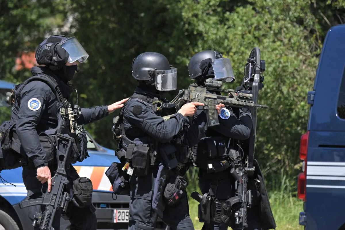 Members of the National Gendarmerie Intervention Group (GIGN) are seen after a municipal policewoman was attacked with a knife in La Chapelle-sur-Erdre, near Nantes, western France, on May 28, 2021. (Loic Venance/AFP via Getty Images)