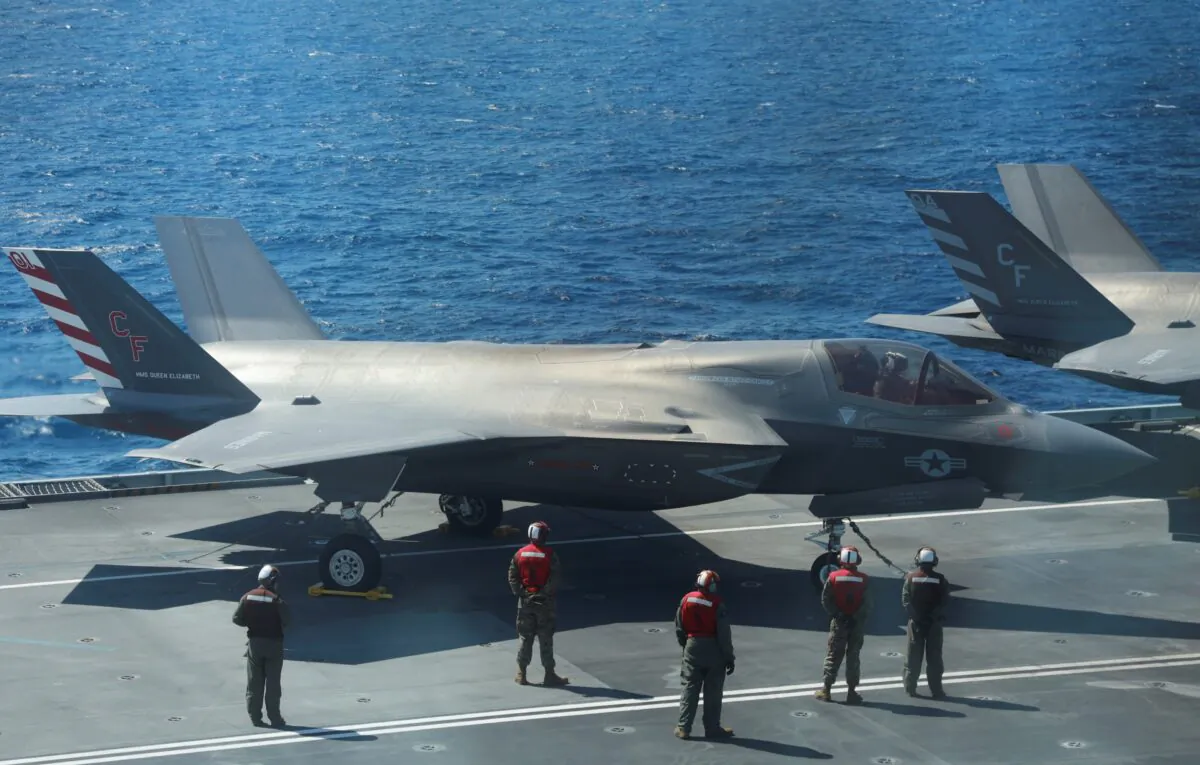 F-35B Lightning II aircrafts are seen on the deck of the HMS Queen Elizabeth aircraft carrier offshore Portugal, on May 27, 2021. (Bart Biesemans/Reuters)