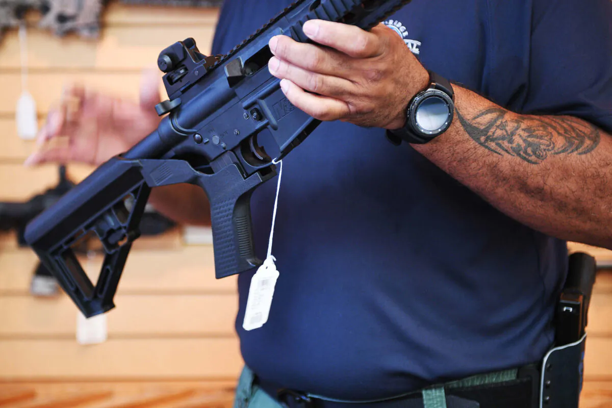 In this file photo,a  bump stock was installed on an AR-15 rifle. (Jim Watson/AFP via Getty Images)
