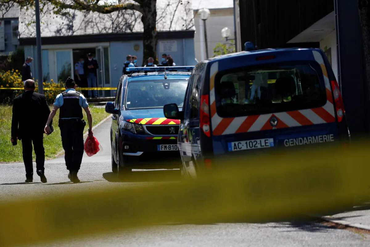 French gendarmes stand in front of the municipal police after an assailant stabbed and badly wounded a policewoman in La Chapelle-sur-Erdre, western France, on May 28, 2021. (Stephane Mahe/Reuters)