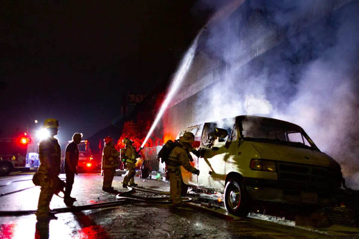 Firefighters put out a blaze in Los Angeles on Nov. 5, 2020. (John Fredricks/The Epoch Times)