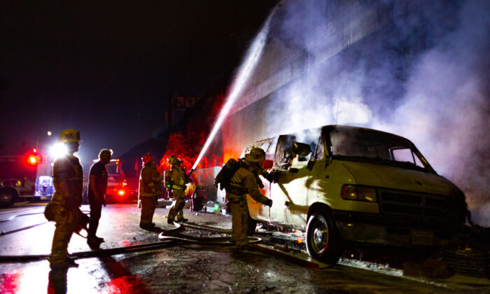 Firefighters put out a blaze in Los Angeles on Nov. 5, 2020. (John Fredricks/The Epoch Times)