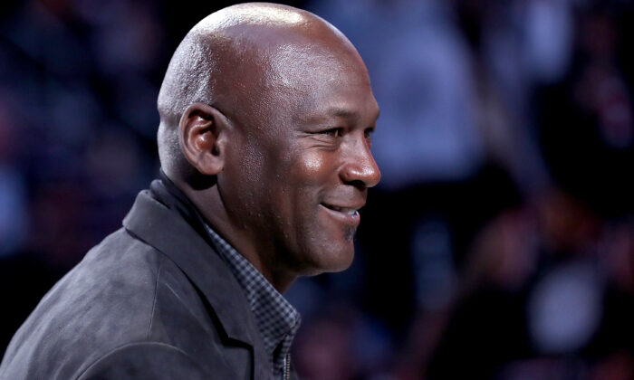 Michael Jordan, owner of the Charlotte Hornets, takes part in a ceremony honoring the 2020 NBA All-Star game during a break in play as Team LeBron take on Team Giannis in the fourth quarter during the NBA All-Star game as part of the 2019 NBA All-Star Weekend at Spectrum Center in Charlotte, N.C., on Feb. 17, 2019. (Streeter Lecka/Getty Images)