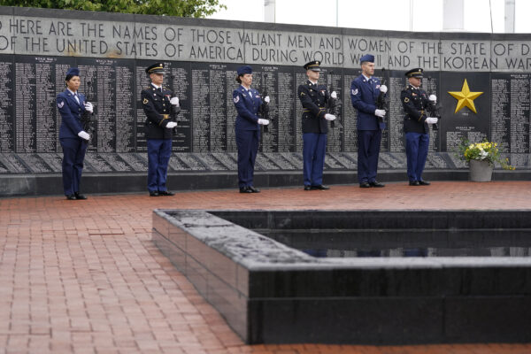 An honor guard stands at attention