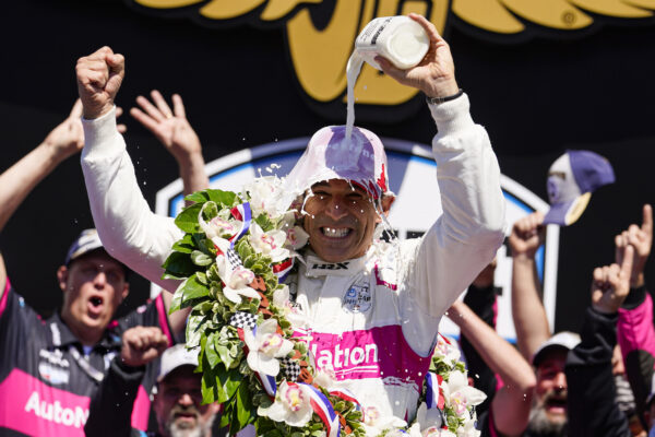 Helio Castroneves of Brazil celebrates