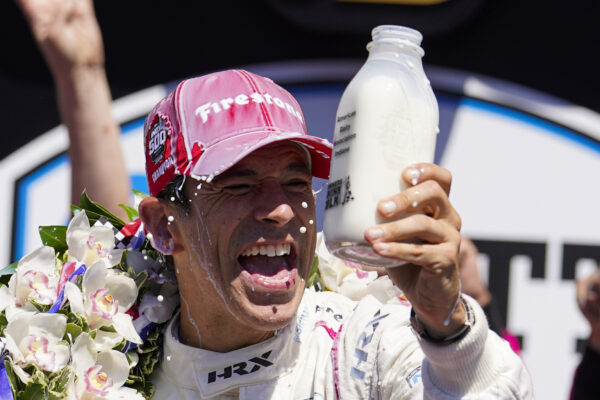 Helio Castroneves of Brazil celebrates