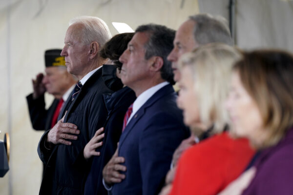 President Joe Biden stands as a rendition