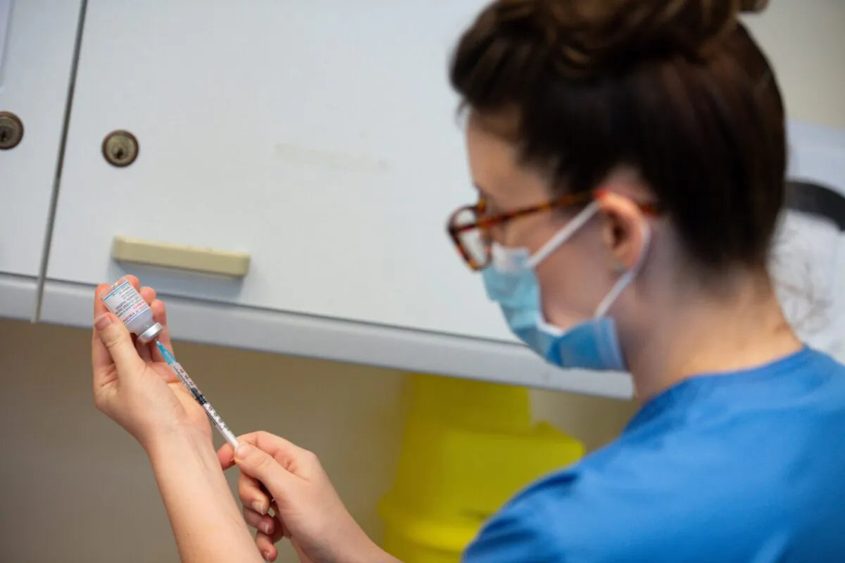 A nurse prepares the Moderna COVID-19 vaccine at the West Wales General Hospital in Carmarthen, UK, on April 7, 2021. (Jacob King/PA)