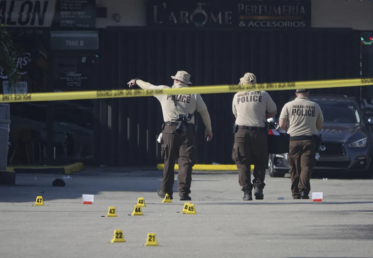 Miami-Dade Police work the scene of a shooting outside a banquet hall near Hialeah, Fla., on May 30, 2021. (Joe Cavaretta/South Florida Sun-Sentinel via AP)