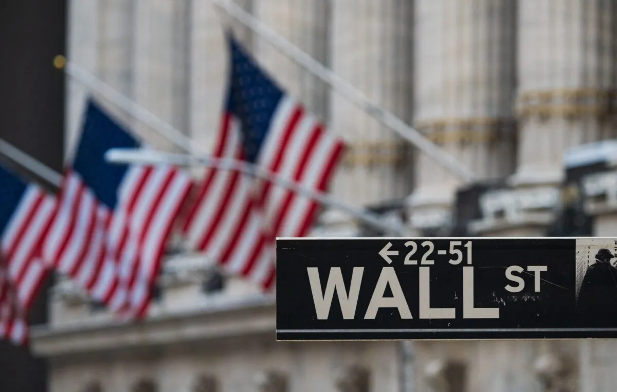 A Wall Street street sign in front of the New York Stock Exchange in New York City in a file photo. (Angela Weiss/AFP via Getty Images)