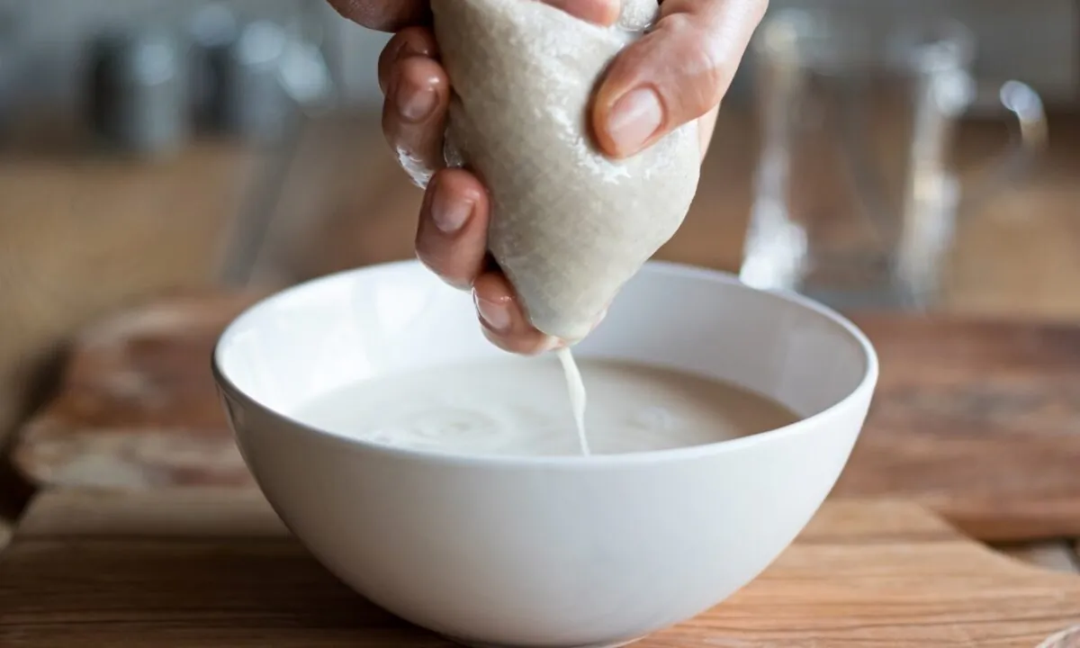 A nut milk bag makes easy work of straining the milk. (Madeleine Steinbach/shutterstock)