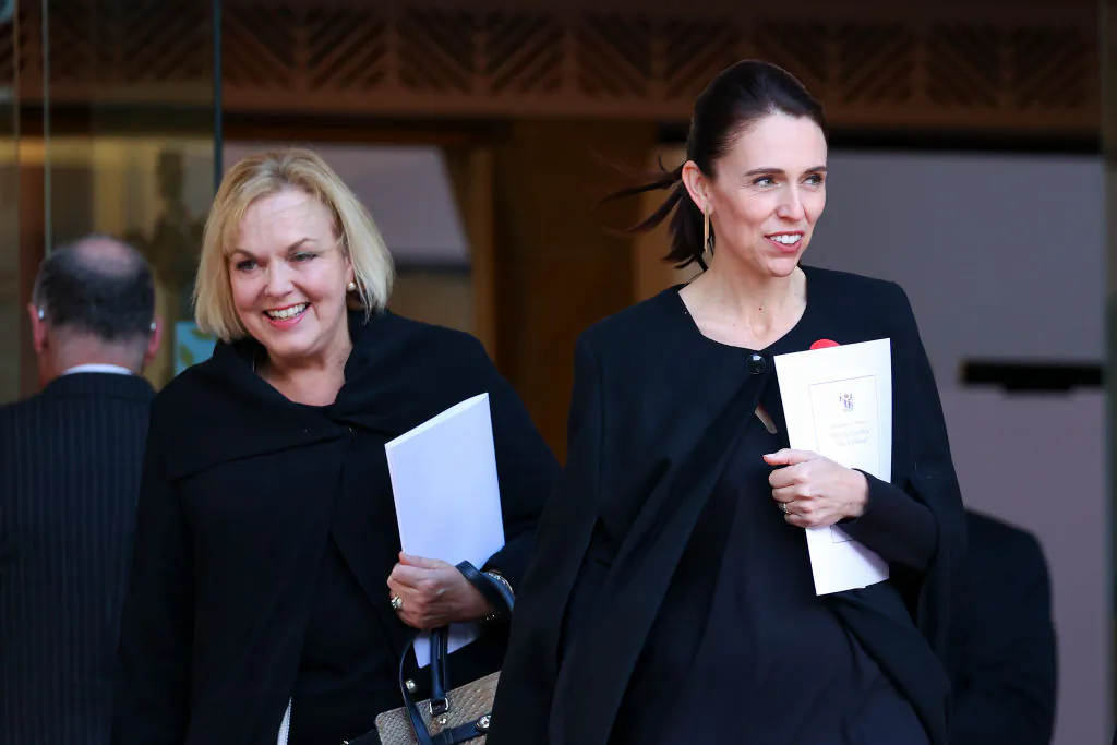 New Zealand Prime Minister Jacinda Ardern (R) and National Party leader Judith Collins look on after the State Memorial Service for Prince Philip, Duke of Edinburgh, at the Wellington Cathedral of St Paul in Wellington, NZ on April 21, 2021 (Hagen Hopkins/Getty Images)