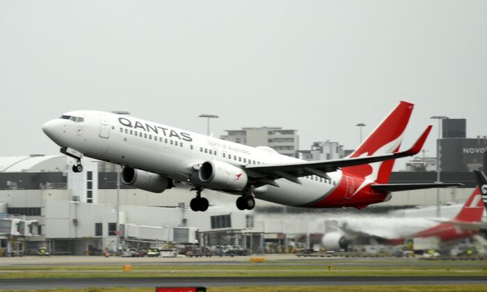 A Qantas plane takes off from the Sydney International airport on May 6, 2021. (Saeed Khan/AFP via Getty Images)