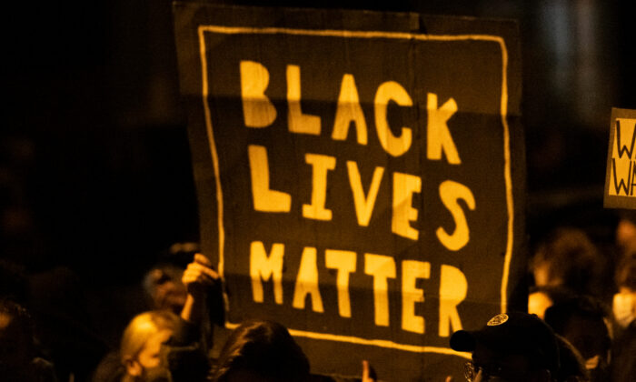 Demonstrators holding placards reading "Black Lives Matter" during a protest in Philadelphia, Pa., on Oct. 27, 2020. (Mark Makela/Getty Images)