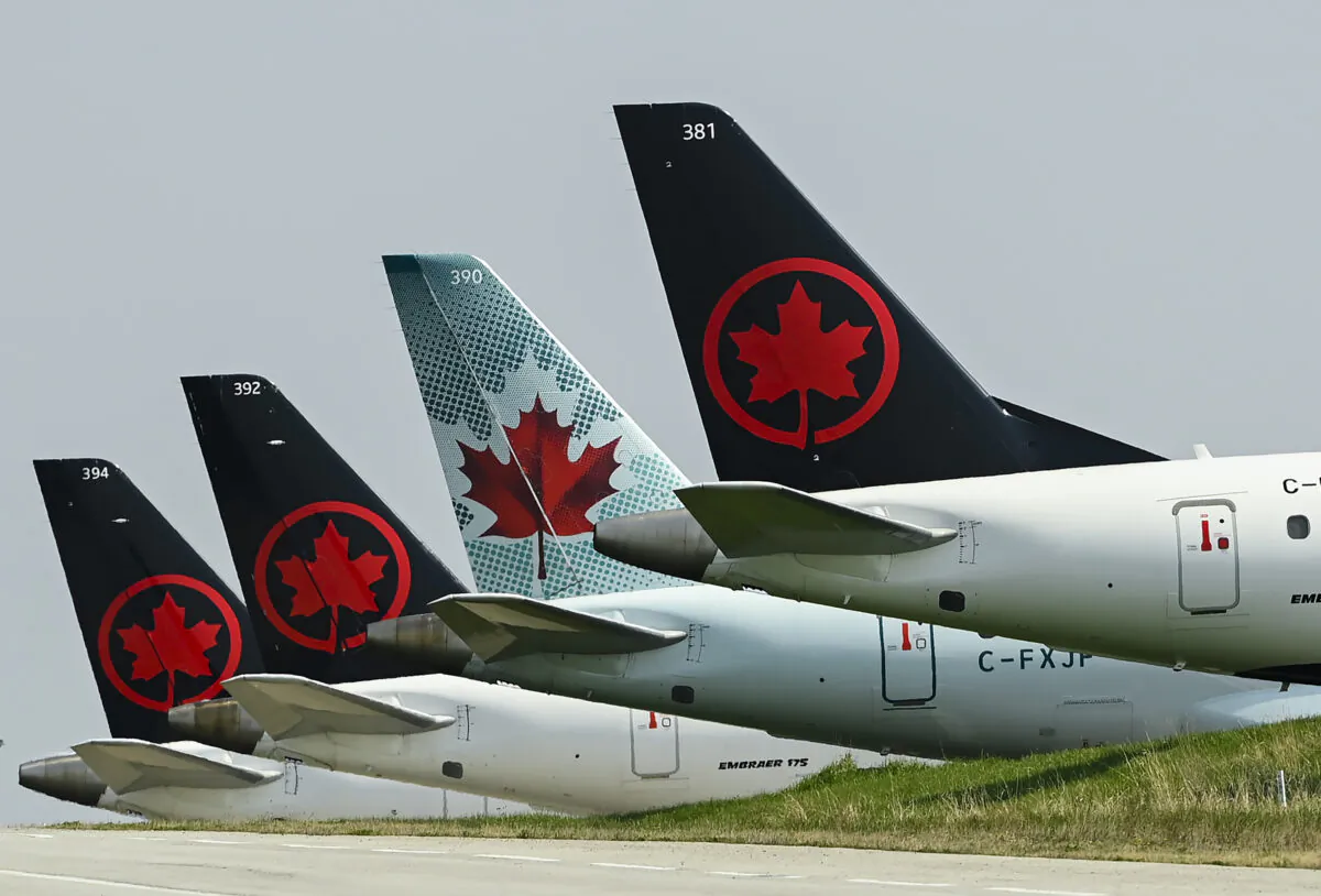 Grounded Air Canada planes sit on the tarmac at Pearson International Airport in Toronto on April 28, 2021. (The Canadian Press/Nathan Denette)