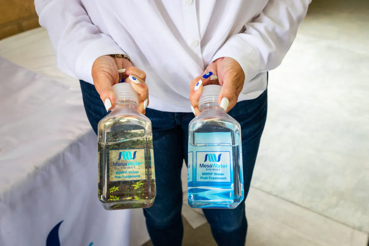 Marice DePasquale, president of Mesa Water District's board of directors, holds samples of water in Costa Mesa, Calif., on June 1, 2021. (John Fredricks/The Epoch Times)