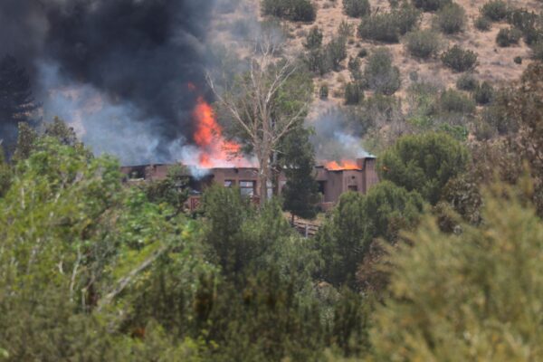 A fire engulfs a house