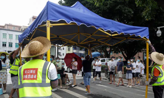 COVID-19 Spreads in China’s Guangdong Province, Cities in Semi-Lockdown