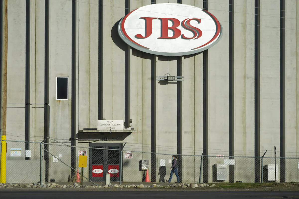 A worker heads into the JBS meatpacking plant in Greeley, Colo., on Oct. 12, 2020. (David Zalubowski/AP Photo)