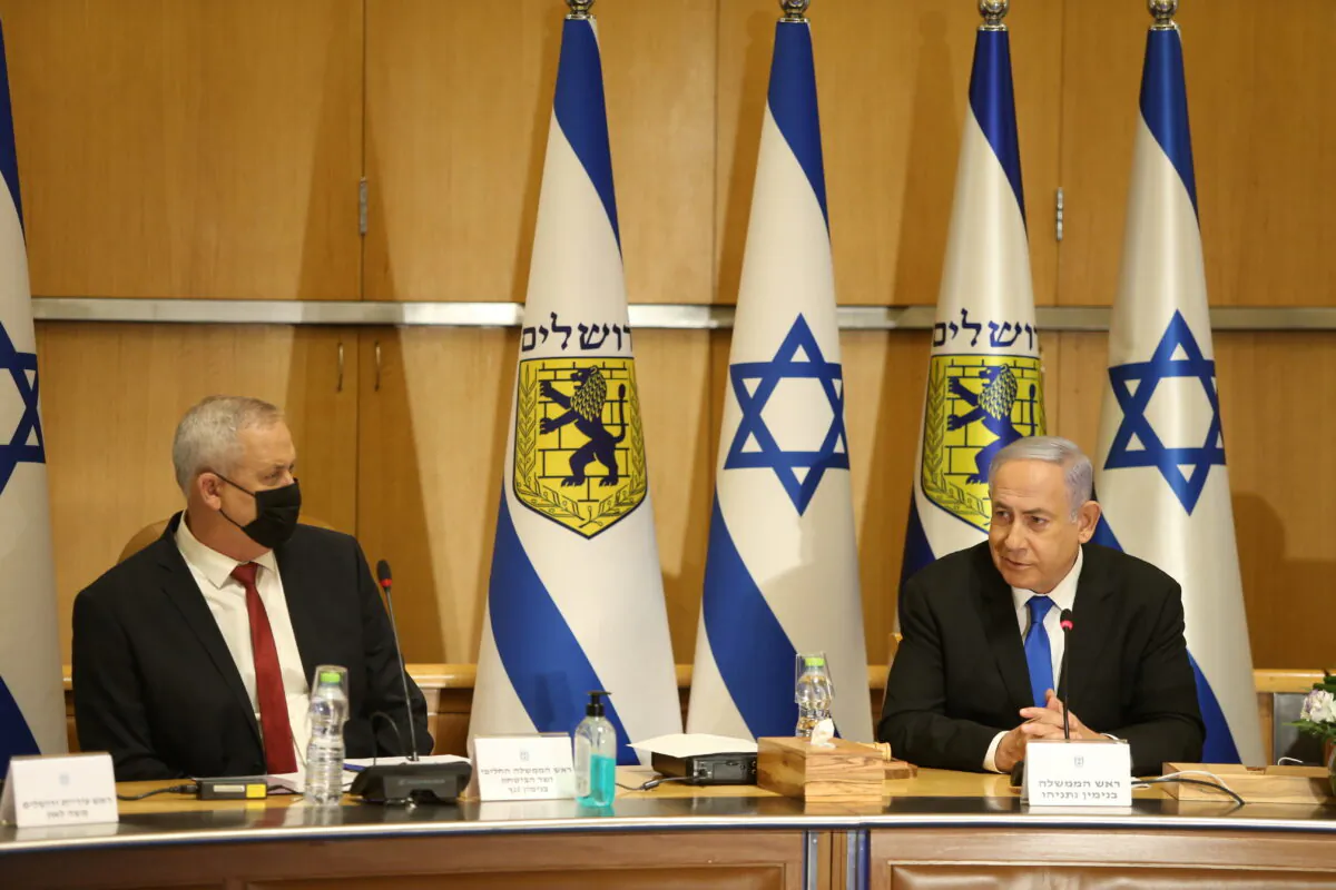 Israeli Prime Minister Benjamin Netanyahu and Minister of Defense Benny Gantz attend a special cabinet meeting on the occasion of Jerusalem Day in Jerusalem, Israel, on May 9, 2021. (Amit Shabi/Pool via Reuters)