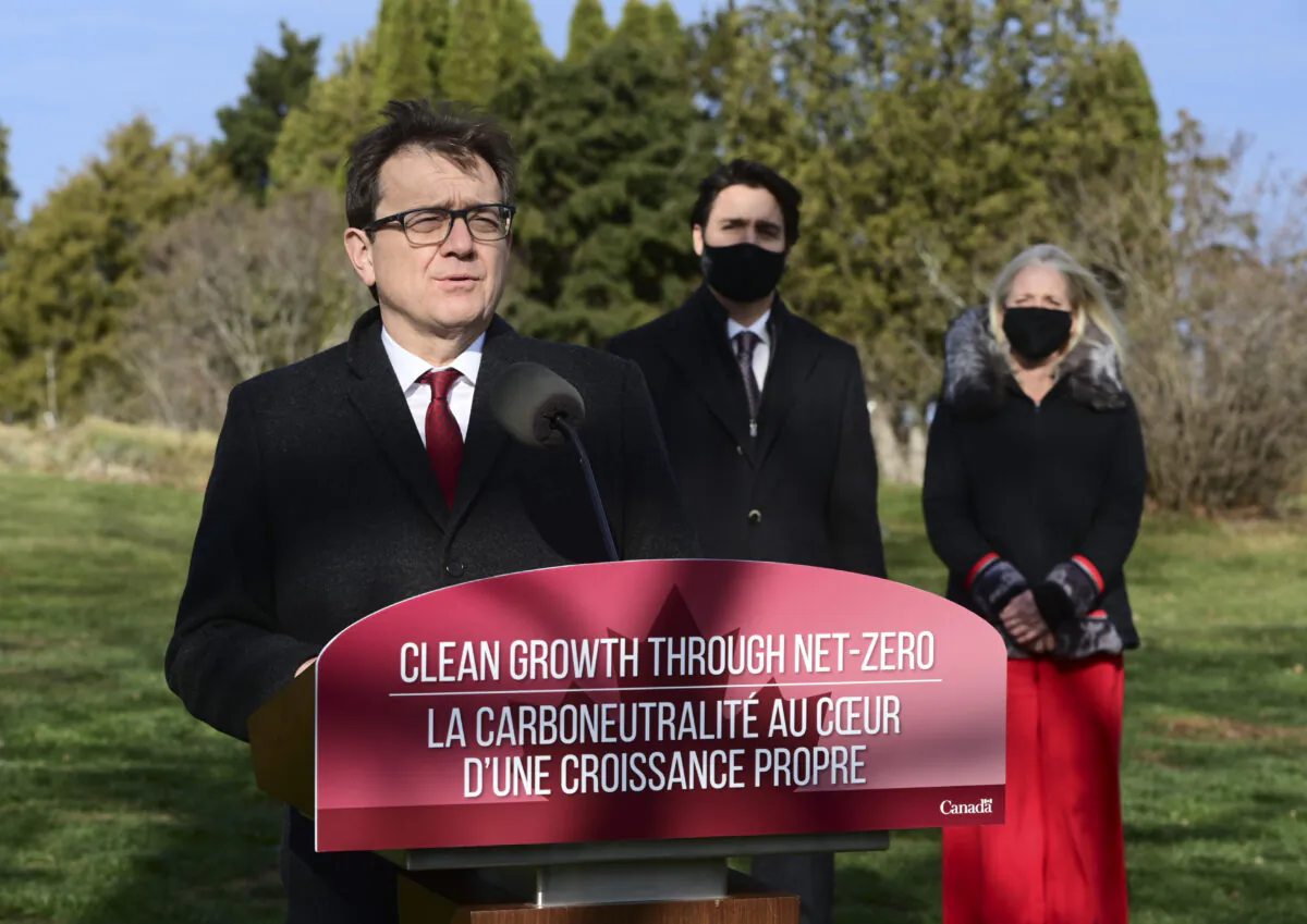 Minister of Environment and Climate Change Jonathan Wilkinson, Prime Minister Justin Trudeau, and Minister of Infrastructure and Communities Catherine McKenna hold a press conference at the Ornamental Gardens in Ottawa on Nov. 19, 2020. (The Canadian Press/Sean Kilpatrick)