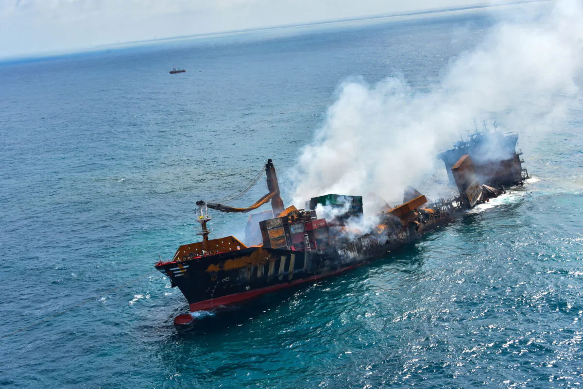 Smoke rises from a fire onboard the MV X-Press Pearl vessel as it sinks while being towed into deep sea off the Colombo Harbour, in Sri Lanka, on June 2, 2021. (Sri Lanka Airforce Media/Handout via Reuters)