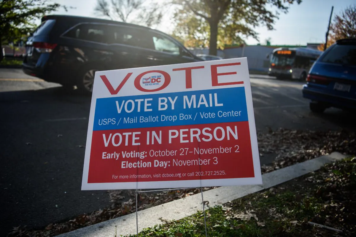 A sign urging people to vote is seen during the US general election in Washington on Nov. 3, 2020. (Nicholas Kamm/AFP via Getty Images)
