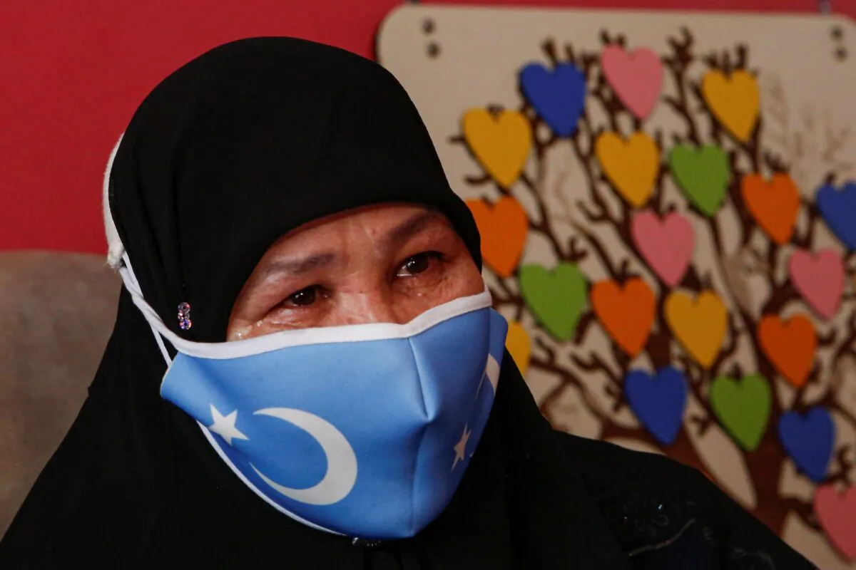Bumeryem Rozi cries during a media interview at her home, in Istanbul, Turkey, on June 1, 2021. (Mehmet Guzel/AP Photo)